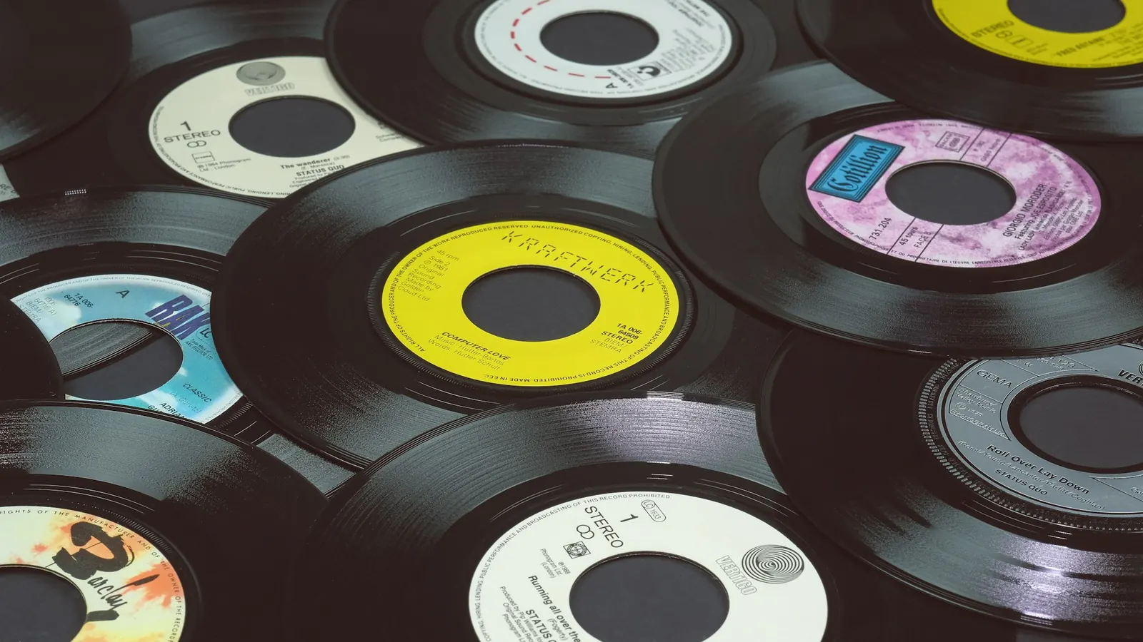 A pile of used 7-inch vinyl singles